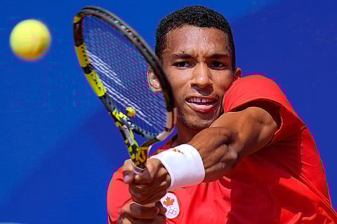 Felix Auger-Aliassime of Canada returns a backhand shot during men's singles semifinals tennis match